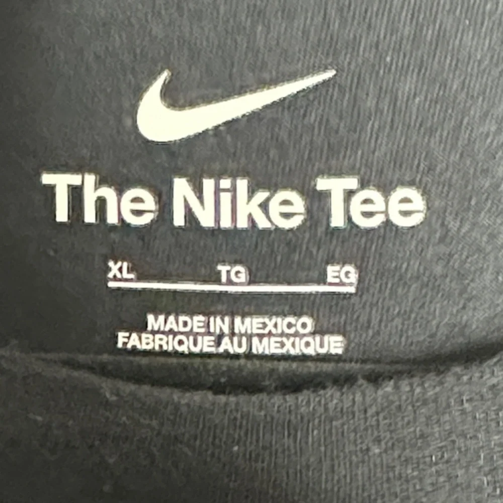 Nike Men's Black Tee with Blue Logo